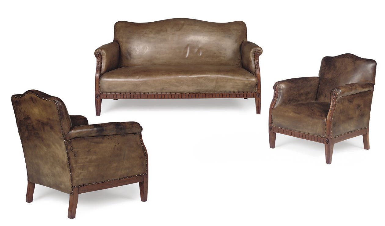 A WALNUT AND LEATHER UPHOLSTERED SUITE