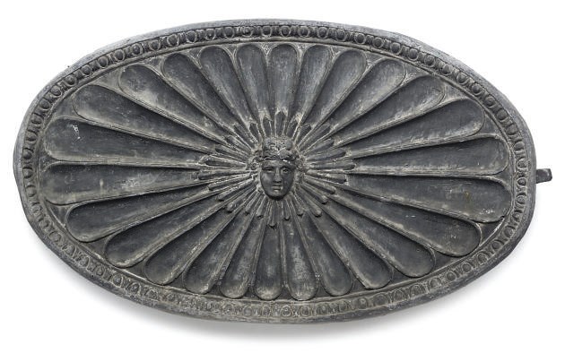 A SET OF FOUR ENGLISH LEAD WALL PLAQUES