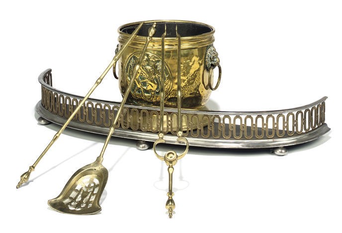 A VICTORIAN STEEL AND BRASS BOW FRONT FENDER