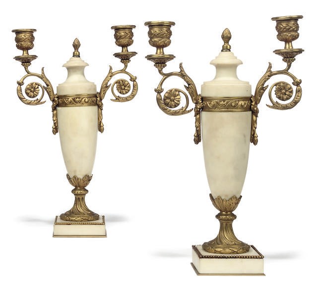 A PAIR OF FRENCH GILT BRONZE AND WHITE MARBLE TWIN-BRANCH CANDELABRA