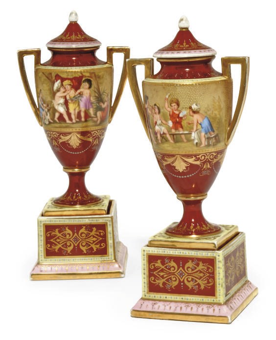 A PAIR OF VIENNA-STYLE CLARET-GROUND VASES AND COVERS