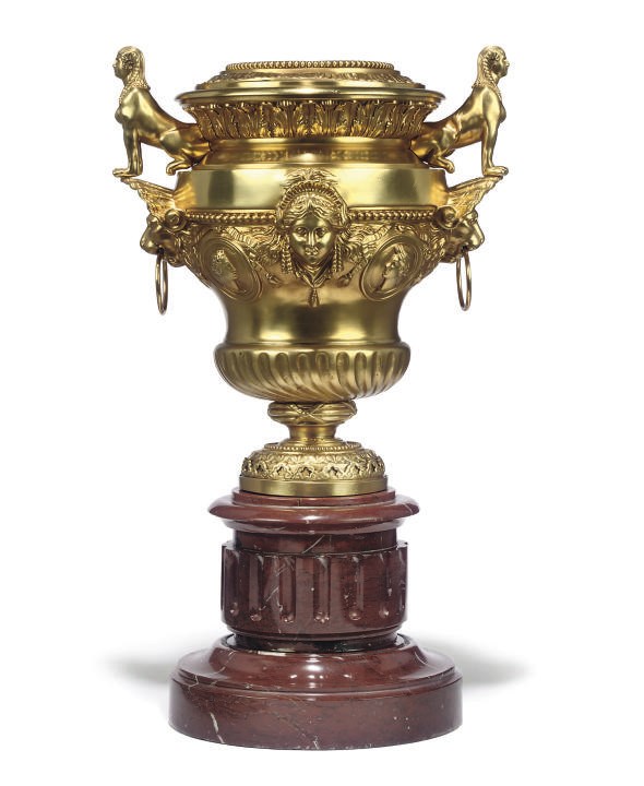 A GILT-BRONZE SPHINX URN