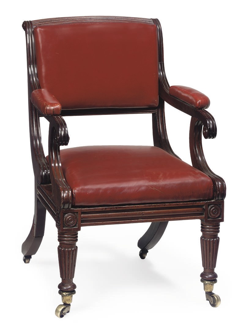 A LATE REGENCY MAHOGANY AND LEATHER UPHOLSTERED OPEN ARMCHAIR
