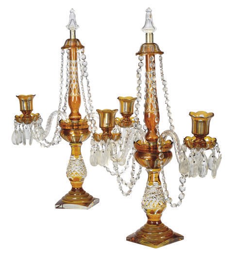 A PAIR OF BOHEMIAN AMBER FLASHED AND CUT GLASS CANDELABRA,