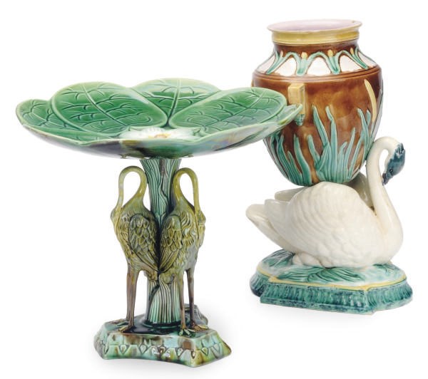 A MAJOLICA COMPOTE MOLDED AS A LILY PAD ON A BIRD-FORM SUPPORT AND A SWAN-FORM VASE,