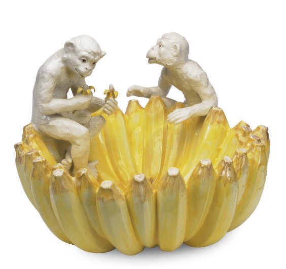 AN ITALIAN EARTHENWARE BOWL MODELED AS MONKEYS ATOP BANANAS,