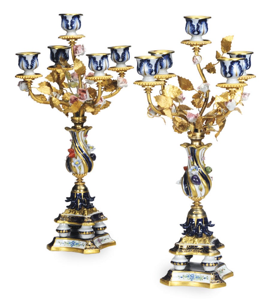 A PAIR OF CONTINENTAL PORCELAIN FLOWER ENCRUSTED AND GILT METAL CANDLESTICKS,