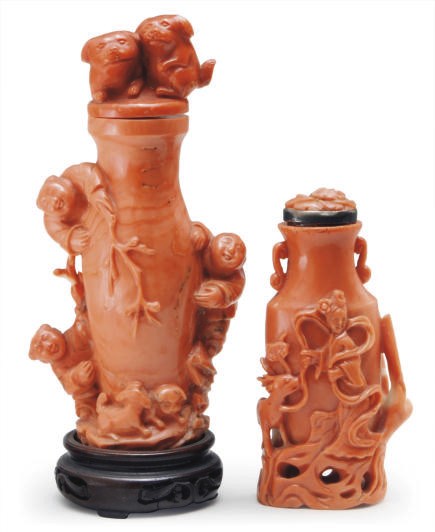 TWO CHINESE CORAL SNUFF BOTTLES AND STOPPERS,**