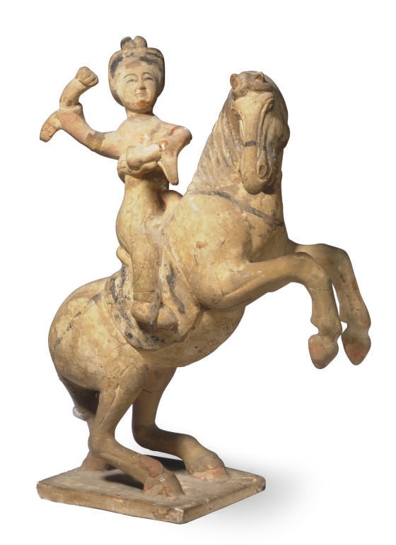 A CHINESE TANG-STYLE POTTERY TOMB FIGURE DEPICTING A HORSE AND RIDER,