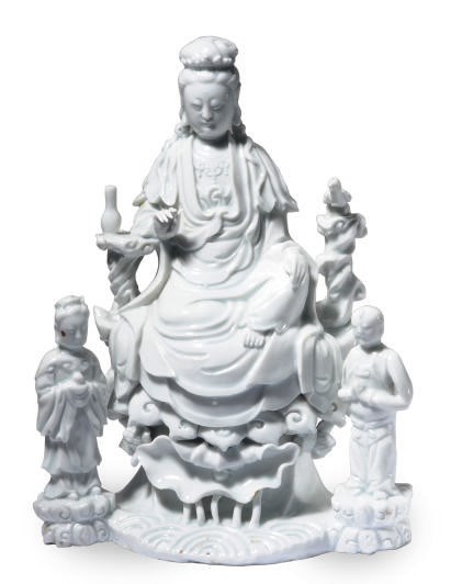 A CHINESE BLANC-DE-CHINE GUANYIN WITH ACOLYTES,