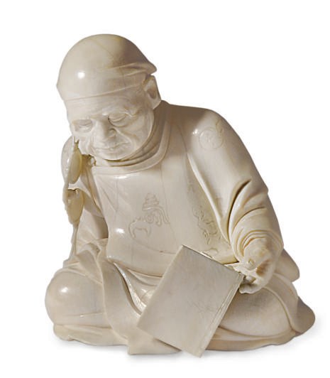 A JAPANESE IVORY FIGURE OF A DROWSING MAN,