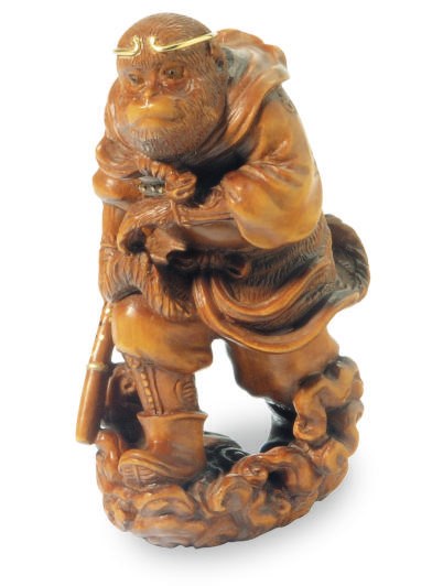 A JAPANESE WOOD FIGURE OF SONGOKU THE MONKEY,