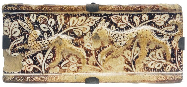 A KASHAN LUSTER TILE MOLDED WITH ANIMALS,
