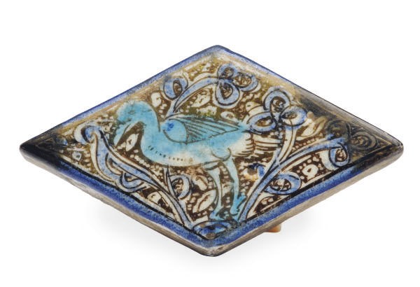 A KASHAN DIAMOND-SHAPED LUSTER AND COBALT POTTERY TILE,