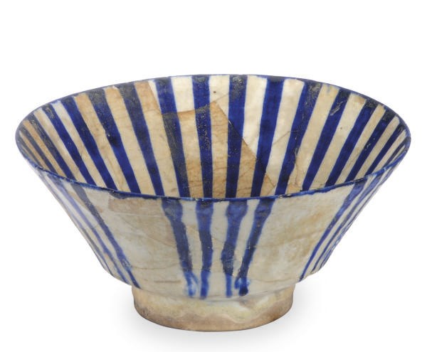 A KASHAN BLUE AND WHITE CONICAL-FORM BOWL,