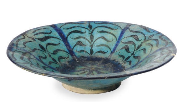 A KASHAN TURQUOISE, BLUE AND BLACK-GLAZED POTTERY DISH,