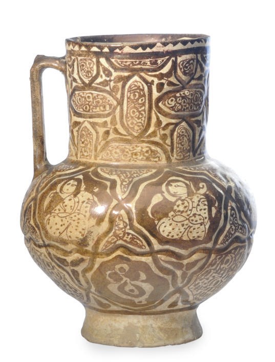 A KASHAN MOLDED LUSTER POTTERY JUG,