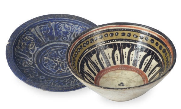 A NISHAPUR COBALT BLUE-GLAZED MOLDED DISH AND A YELLOW, ORANGE AND BROWN-GLAZED BOWL,**