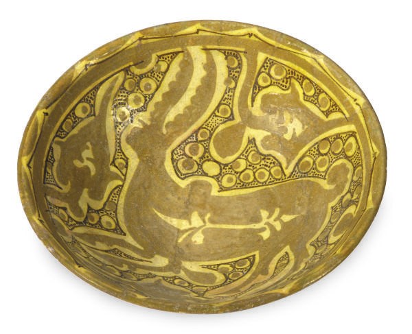 A NISHAPUR POTTERY BOWL PAINTED WITH A DEER,