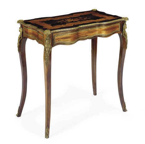 A NAPOLEON III BRASS-MOUNTED ROSEWOOD AND FRUITWOOD MARQUETRY DESK**,