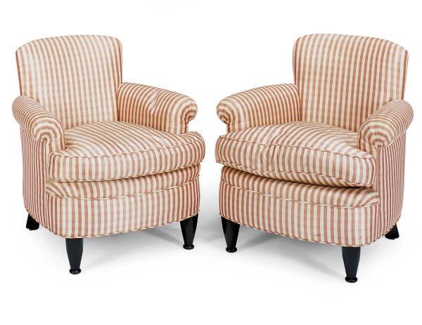 A PAIR OF EBONIZED AND UPHOLSTERED CLUB CHAIRS,