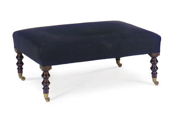 A MAHOGANY AND UPHOLSTERED POUF,