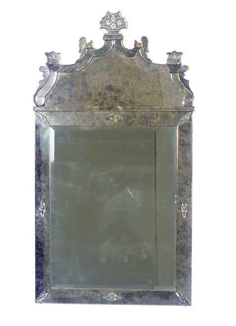 AN ETCHED GLASS MIRROR,