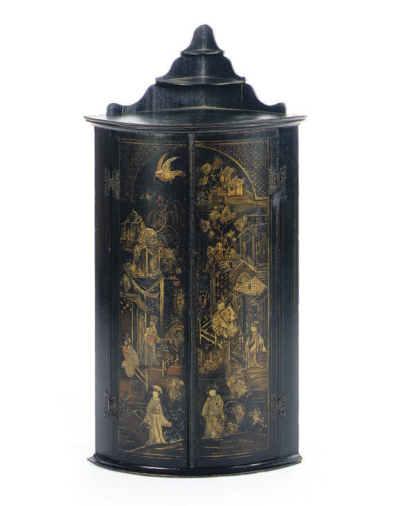 A BLACK AND GILT-JAPANNED CORNER CABINET,