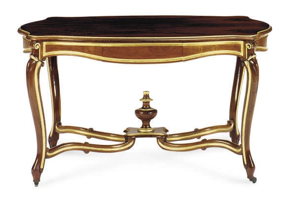 A ROSEWOOD AND PARCEL-GILT SERPENTINE WRITING TABLE**,