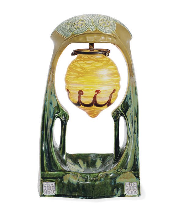 A GLAZED CERAMIC AND IRIDESCENT GLASS TABLE LAMP,