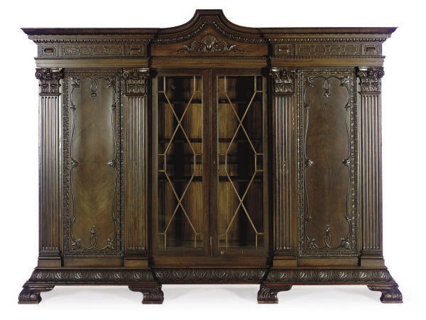 A STAINED WOOD BREAKFRONT BOOKCASE,