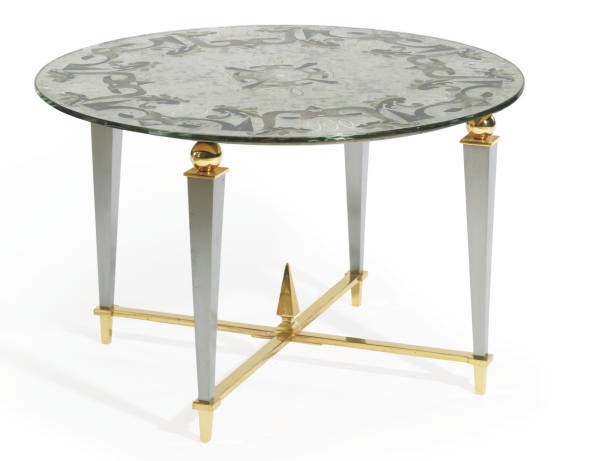 A STEEL, GILT-BRONZE AND VERRE-EGLOMISE TABLE,