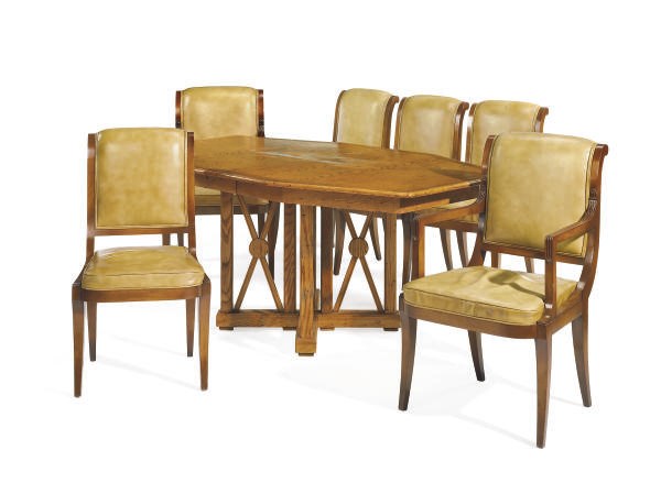 AN OAK DINING TABLE AND SET OF SIX WALNUT AND LEATHER UPHOLSTERED DINING CHAIRS,