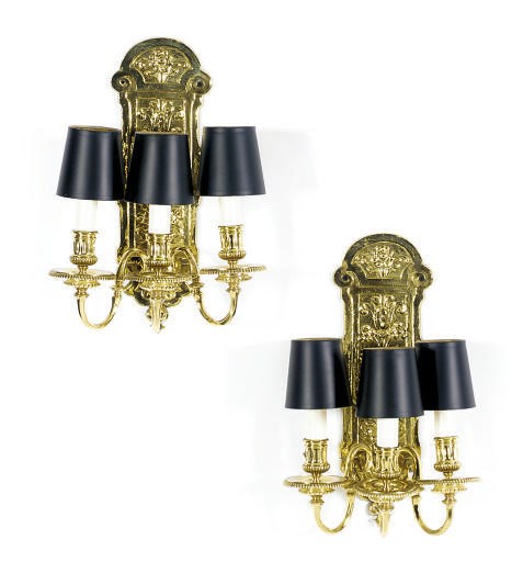 A SET OF FOUR BRASS THREE-BRANCH WALL-LIGHTS,