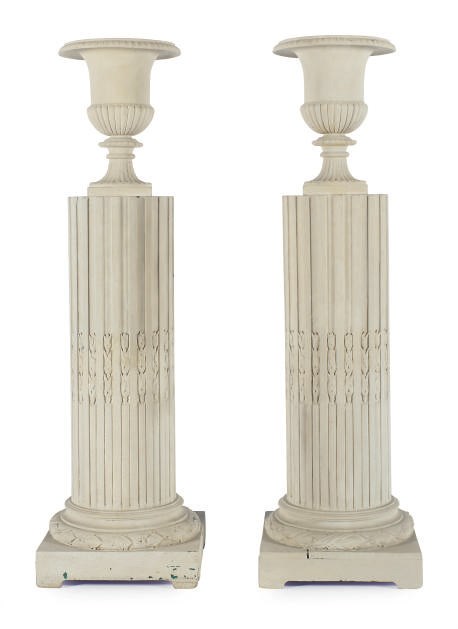 A PAIR OF URNS ON PEDESTALS,