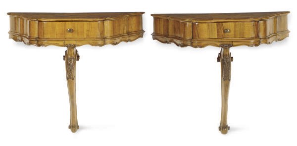 A PAIR OF CONTINENTAL WALNUT SERPENTINE CONSOLE TABLES,