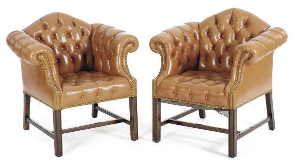 A PAIR OF MAHOGANY AND BUTTON-TUFTED LEATHER UPHOLSTERED ARMCHAIRS,