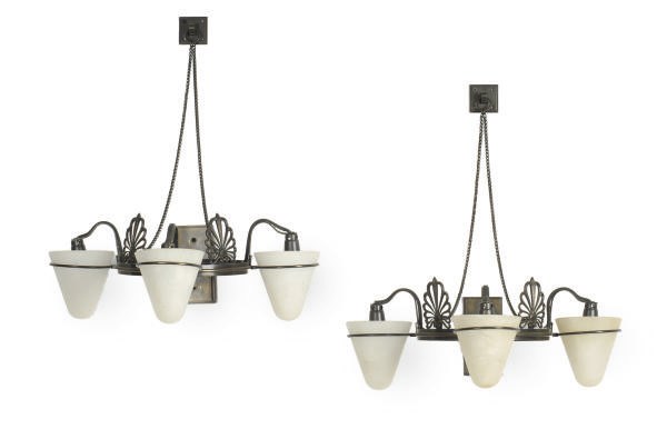 A PAIR OF PATINATED BRONZE AND ALABASTER THREE-BRANCH WALL-LIGHTS,