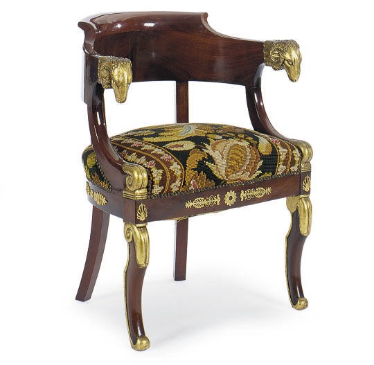AN EMPIRE ORMOLU-MOUNTED AND PARCEL-GILT MAHOGANY FAUTEUIL DE BUREAU,