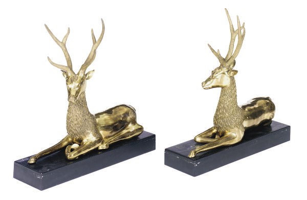 A PAIR OF SOUTHEAST ASIAN BRASS STAGS