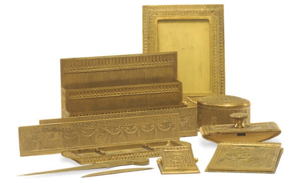 A GILT-BRONZE 'ADAMS' PATTERN DESK SET,
