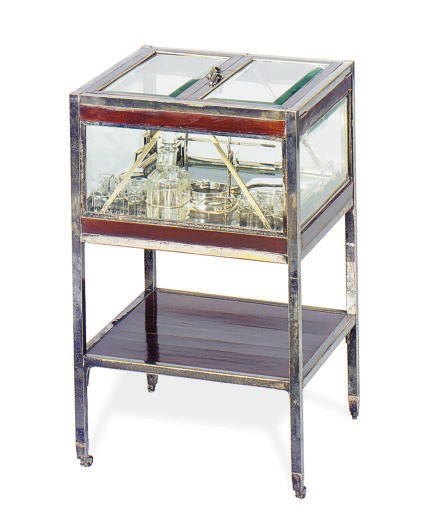 A CHROMED-METAL AND MAHOGANY DRINK'S CART,