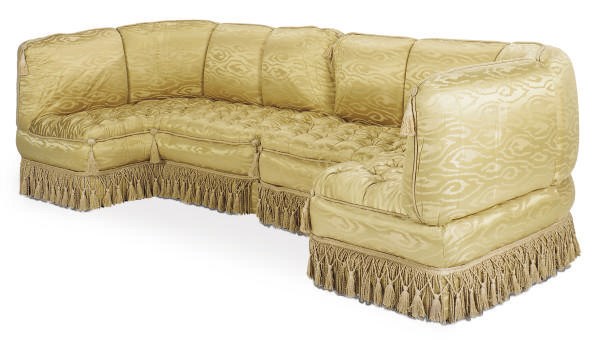 A GOLD SILK UPHOLSTERED SECTIONAL SOFA,