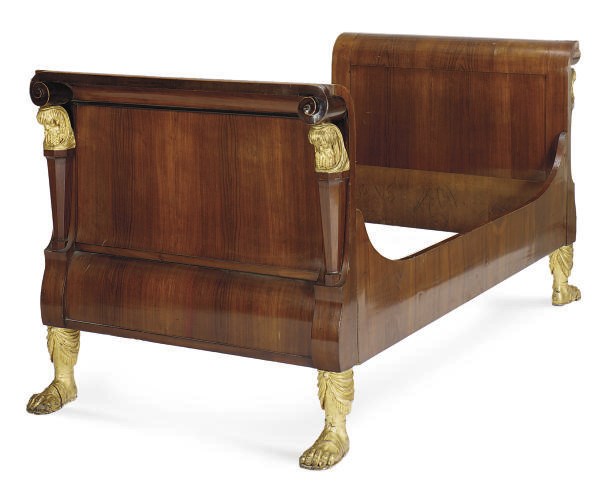 A CONTINENTAL FRUITWOOD AND PARCEL-GILT DAYBED,