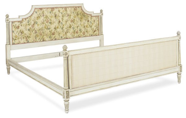 A CREAM AND GREEN-PAINTED FLORAL UPHOLSTERED BED,