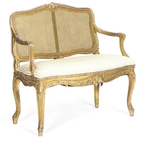 A GILTWOOD AND CANED SERPENTINE SETTEE,