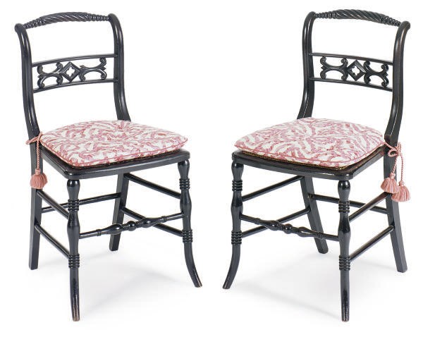 A SET OF SIX EBONIZED AND CANED DINING CHAIRS,