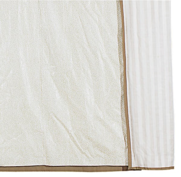 A GROUP OF BEIGE AND CREAM LINEN AND 'CHINTZ' CURTAINS AND BED HANGINGS,