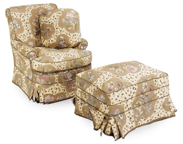 A PAIR OF CHINTZ UPHOLSTERED CLUB CHAIRS AND AN OTTOMAN