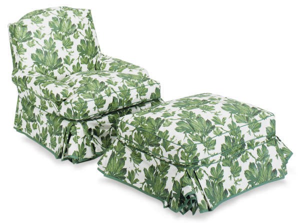 A GREEN AND WHITE CHINTZ UPHOLSTERED CLUB CHAIR AND OTTOMAN,
